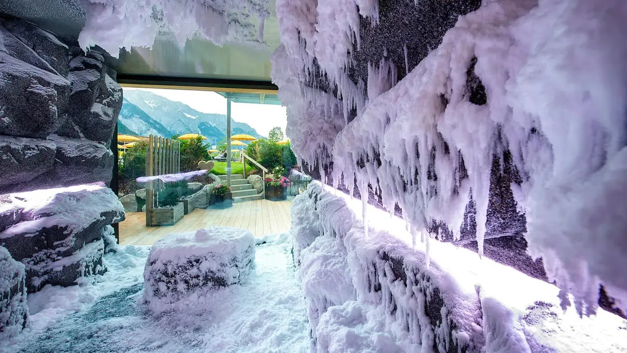 Snow room with icicles and a view of the terrace and mountains