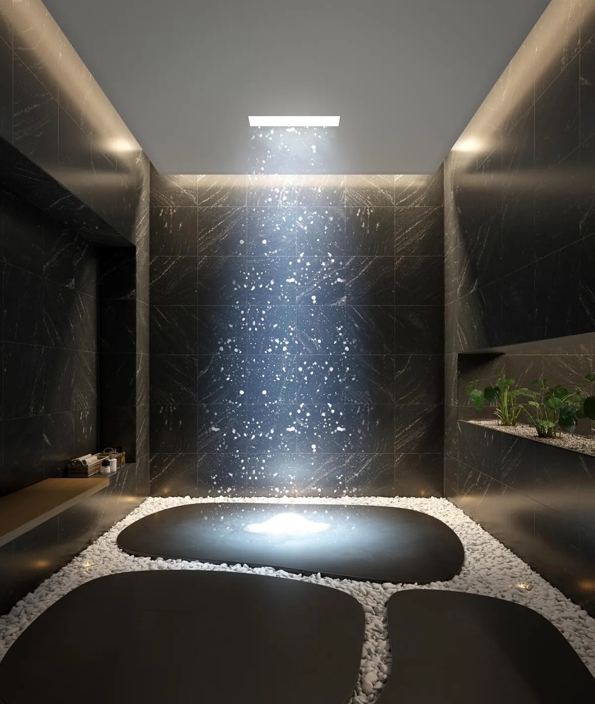 Snow shower in a room of dark natural stone: snowflakes fall from a ceiling panel onto a floor island of white pebbles